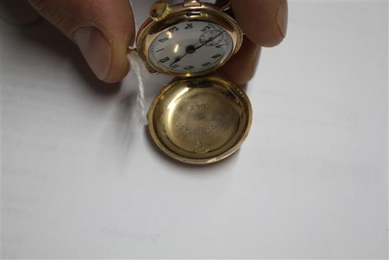A ladys 1930s yellow metal (stamped 9c) Golfball? manual wind wristwatch, with hinged cover, no strap,